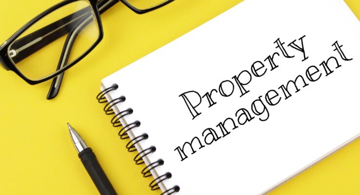 A Client’s Guide to Working with a Building Construction Company in UAE 1 blank paper with inscription property management on a yellow background