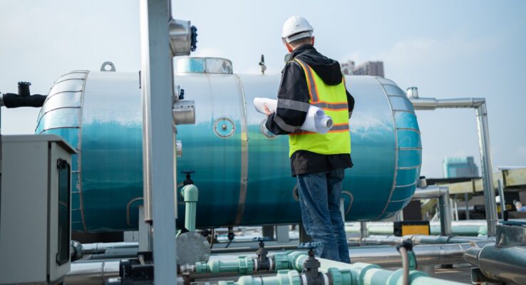 Why Businesses Trust Us for Facility and Property Management 1 Engineer Performing Maintenance on Industrial Pipes