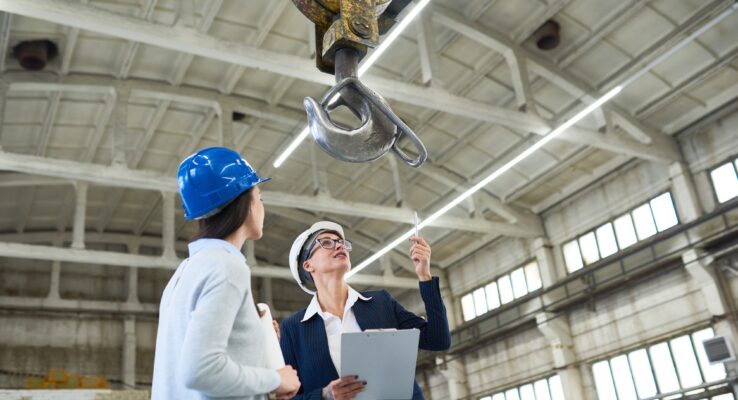 Female building contractors visiting construction site