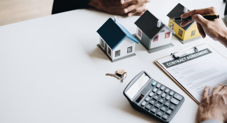 Real-estate agent talking with his customer. moving home or renting property.